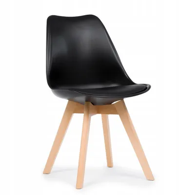 A black dining chair with wooden legs against a white background.