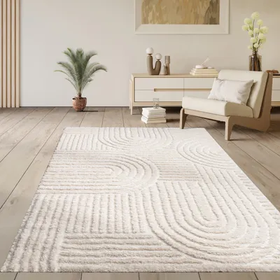 A living room scene with a rug, chair, and furniture.