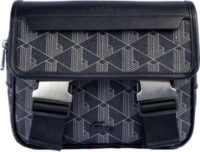 A close-up studio shot of a black Lacoste messenger bag with a geometric pattern.