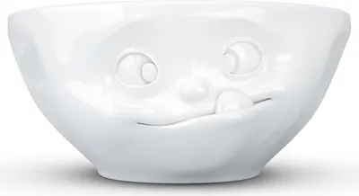 A white ceramic bowl with a face design.