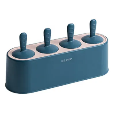 A teal and pink ice pop mold with four popsicle sticks inserted.