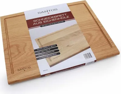 A wooden cutting board with packaging.