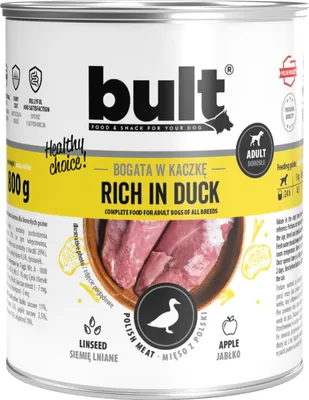 A can of dog food with an image of duck meat and ingredients.