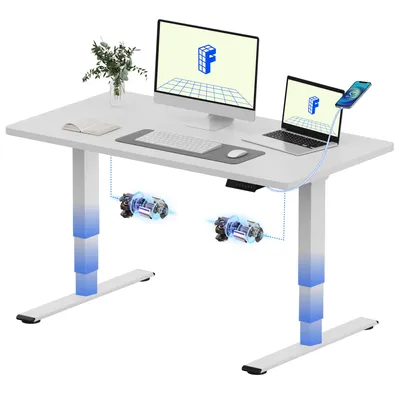 A white adjustable standing desk with a computer monitor, laptop, keyboard, mouse, and a phone charging on a stand.