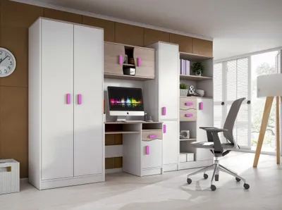A modern white and wood tone wall unit with pink accents, featuring a desk, computer, wardrobe, and shelving, set in a brightly lit room.