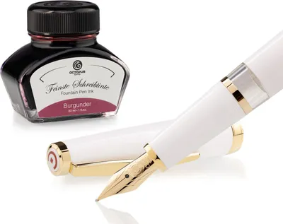 Produktbild von Set mit den Füllfederhaltern Cleo Skribent Classic Gold Weiß – Füllfederhalter mit Kolbenmechanismus und 30 ml Borgogne-Tinte