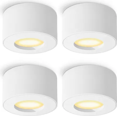 Four white ceiling lights arranged in a 2x2 grid against a white background.