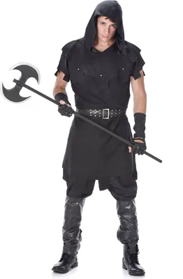 A man wearing a medieval executioner costume holding an axe.
