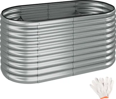 A silver, oval-shaped raised garden bed made of corrugated metal, shown from a slightly elevated side angle. A pair of white work gloves is placed in the bottom right corner.