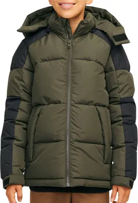 A child wearing a green and black puffer jacket.