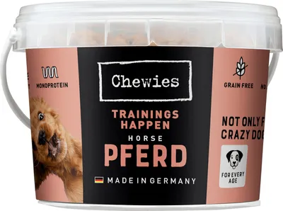 A bucket of dog treats with a picture of a lion on the front.