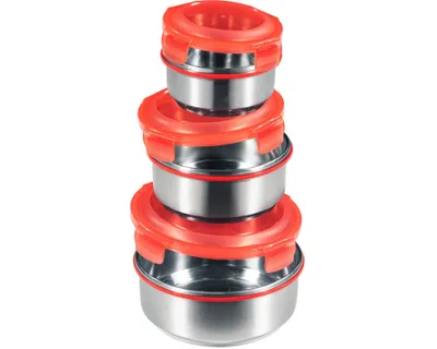 A stack of four stainless steel food storage containers with red lids, arranged vertically.