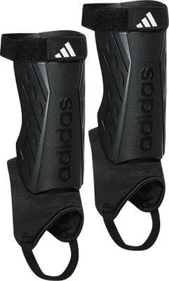 A pair of black Adidas shin guards are shown against a white background.