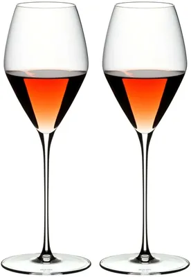 Two wine glasses filled with rose wine.