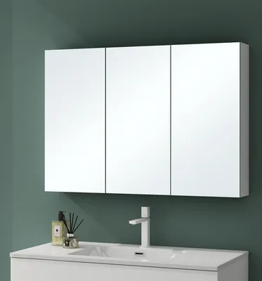 A bathroom vanity with a medicine cabinet and sink.