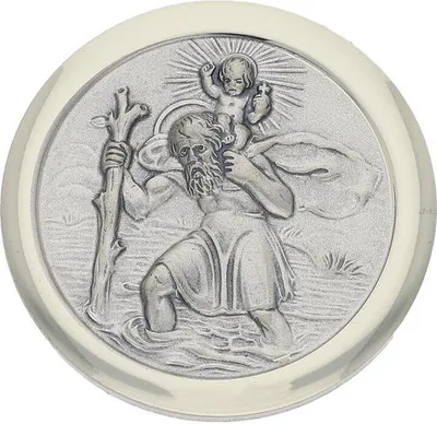 A silver medallion depicting Saint Christopher carrying the Christ child across a river.