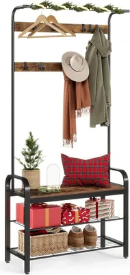 A coat rack with shelves, decorated for Christmas.