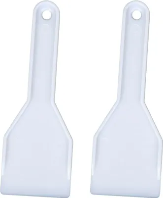 Two white plastic ice scrapers are shown against a white background.