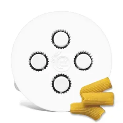 A white pasta maker attachment with four circular openings and a few pieces of rigatoni pasta.