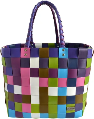 A colorful woven shopping basket is shown against a white background.