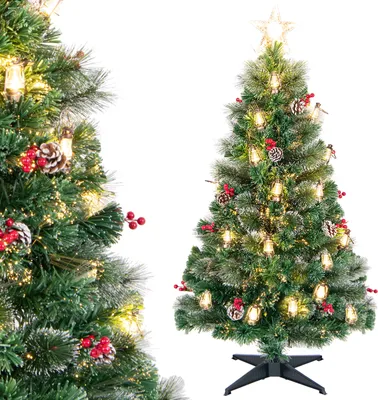 A decorated artificial Christmas tree with lights, pine cones, and red berries, shown from two angles.