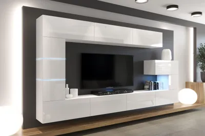A modern living room entertainment center with a wall-mounted TV and shelving.