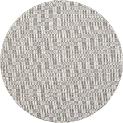 A round, gray rug is shown against a white background.