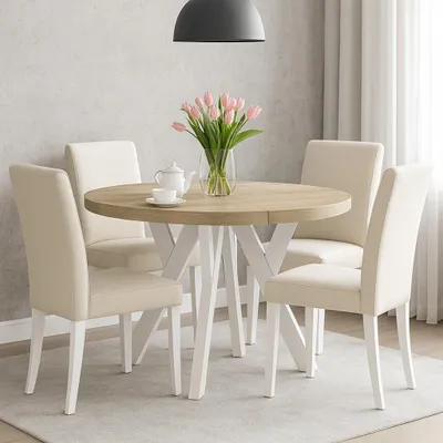 A round dining table with chairs in a dining room setting.