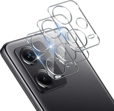A close-up view of a smartphone's camera lens area with protective glass covers being applied.