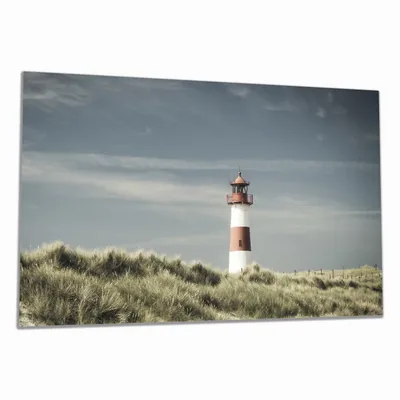 Produktbild von Wallario Herdabdeckplatte aus Glas, Größe 90 x 52 cm 1-teilig, Motiv Leuchtturm auf der Düne am Strand