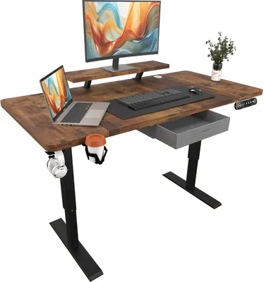 A standing desk setup with a monitor, laptop, keyboard, and accessories.