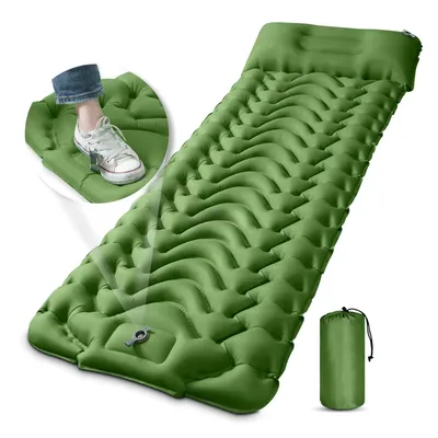 A green inflatable camping mattress with an integrated foot pump and pillow, shown with a close-up inset of a foot pressing the pump.