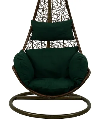 A hanging chair with dark green cushions against a white background.