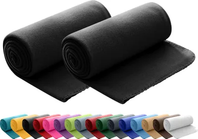 Two rolled-up black fleece blankets are shown in the foreground, with a row of differently colored rolled-up blankets in the background.