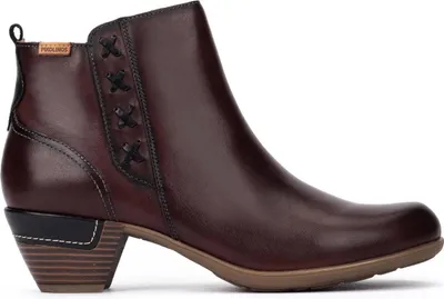 A side view of a brown leather ankle boot with a stacked heel.
