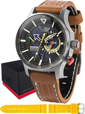 A Vostok Europe watch with a brown leather strap, presented with its box and an extra yellow strap.