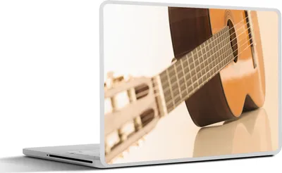 Produktbild von MuchoWow® Laptop Aufkleber Sticker Cover Eine auf der Seite liegende akustische Gitarre 30x22 cm - Laptop-Sticker