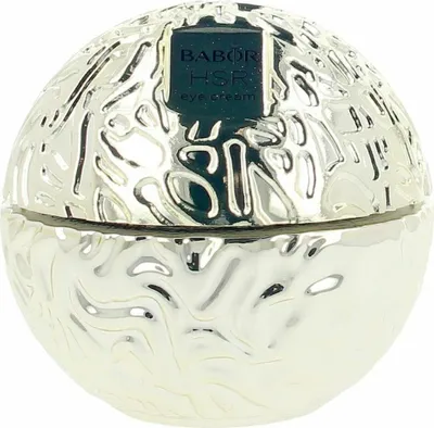 A silver, spherical jar of eye cream with a textured surface and a black label.