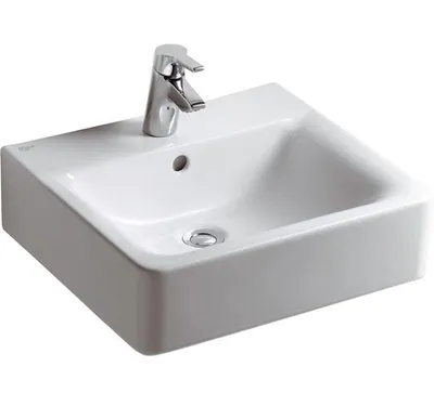 A white ceramic sink with a chrome faucet.