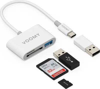 A white VOOMY USB-C SD card reader is shown with a USB-A adapter, a black USB adapter, a SanDisk SD card, and a microSD card on a white background.