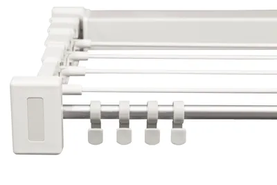 A close-up view of a white retractable clothes drying rack.