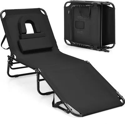A black foldable lounge chair with a face opening and a removable cushion is shown. A folded version of the chair is visible in the background.