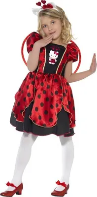 A young girl wearing a Hello Kitty ladybug costume.