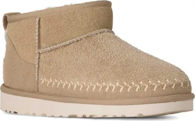 A single beige UGG boot is shown against a white background.