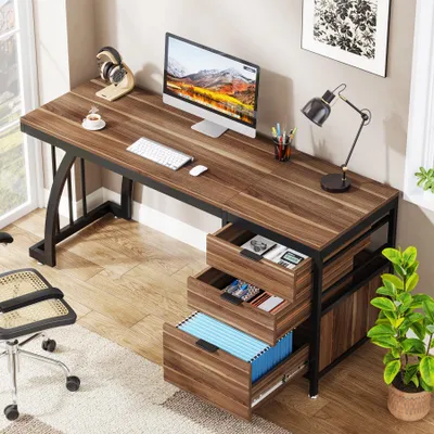 A home office setup with a desk, computer, and chair.