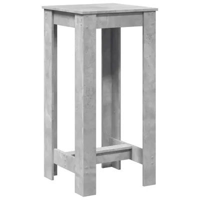 A tall, narrow bar table with a concrete gray finish.