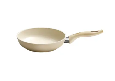 A single cream-colored frying pan with a silver metal accent and a cream-colored handle is shown against a white background.