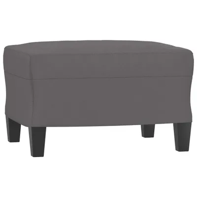 A gray upholstered ottoman with dark wooden legs.