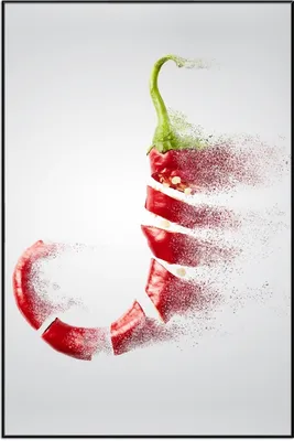 Produktbild von Wallario Wandbild Chilischote löst sich in Pulver auf, Größe: 61 x 91,50 cm, Poster mit schwarzem Aluminiumrahmen