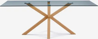 A table with a glass top and wooden legs against a white background.